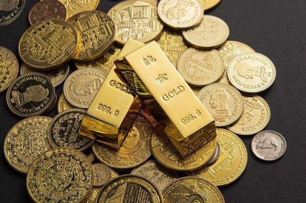 Two gold bars above scattered coins