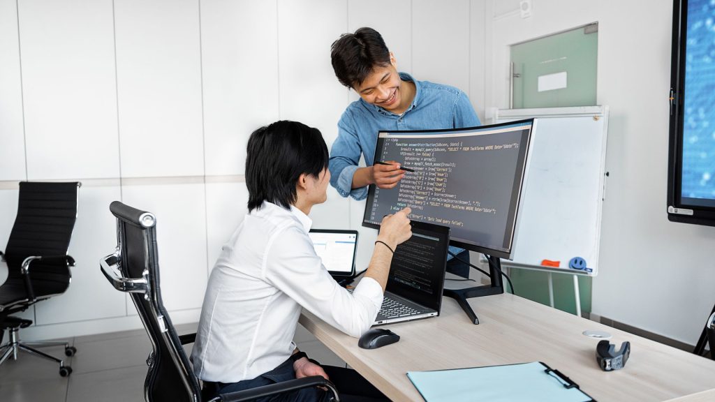 Before Integrating a Public-Record API, What Should Product Teams Verify? Engineers reviewing code on a monitor: Before Integrating a Public-Record API, What Should Product Teams Verify?
